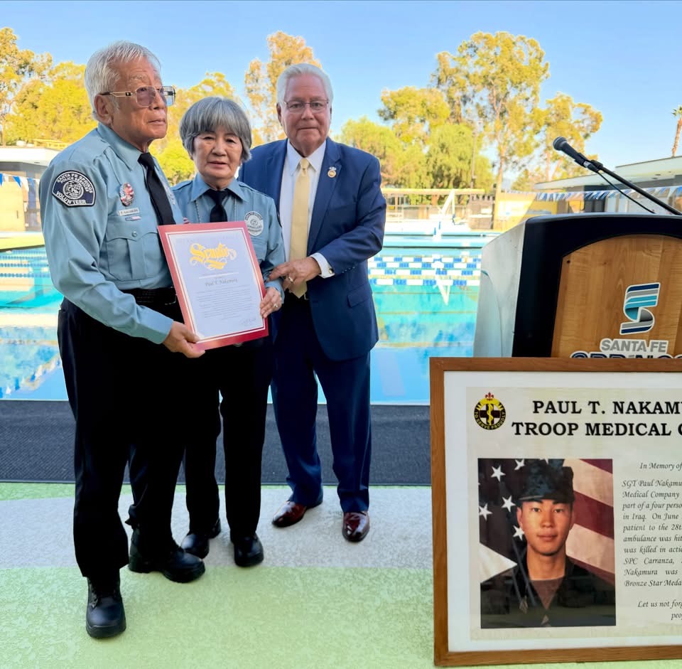 Senator Bob Archuleta presents a California State Certificate of Recognition to the parents of U.S. Army medic Paul T. Nakamura at the Grand Reopening of the Aquatic Center named after their son.