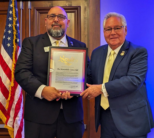 Senator Archuleta presents certificate of recognition to Montebello Lions Club President Mike Reyes in honor of its 100th anniversary.