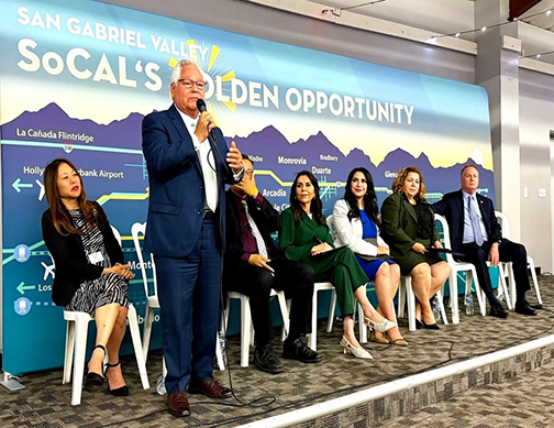 Senator Bob Archuleta speaking at the San Gabriel Valley Legislative Networking Reception. He is onstage with fellow elected officials.