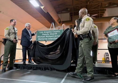 Senator Bob Archuleta pictured with members of the Los Angeles County Sheriff’s Department Industry Station at the unveiling of freeway memorial sign.